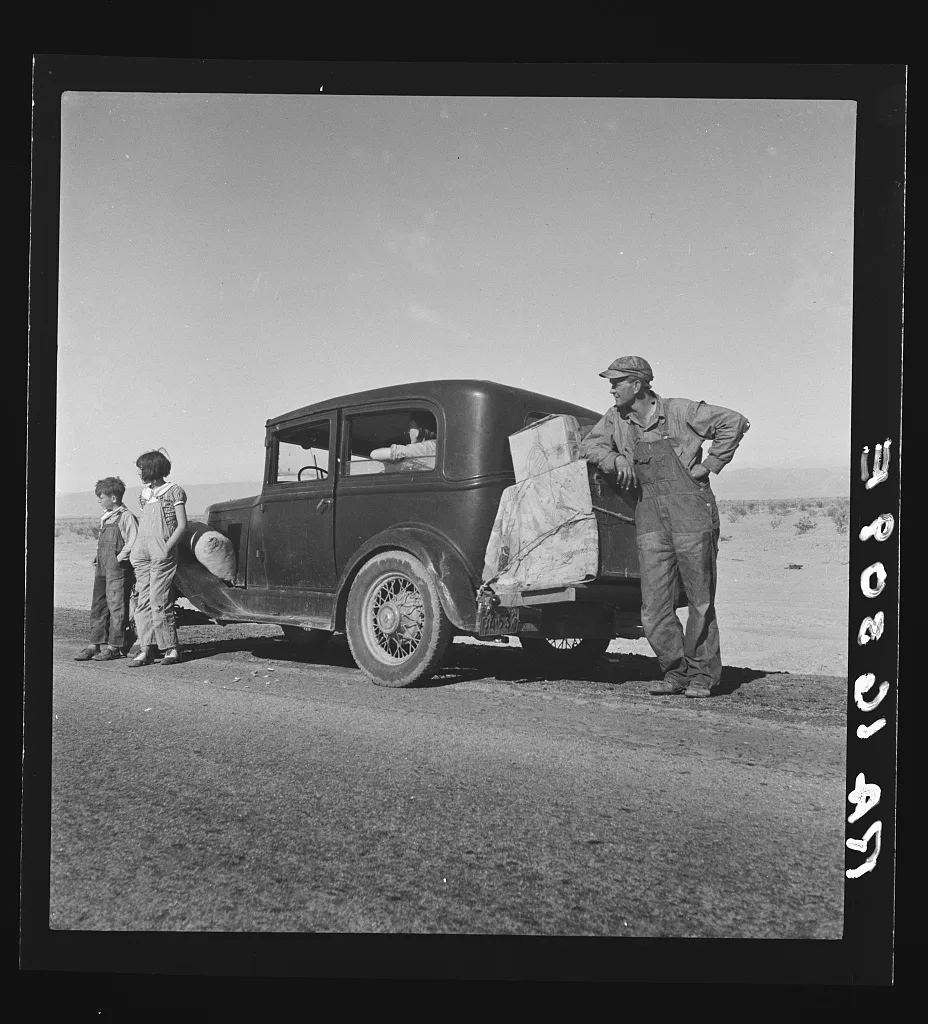 Oklahoma sharecropper entering California stalled on desert with his…, 1937