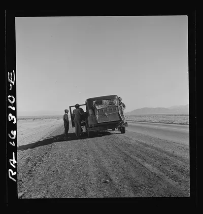 Oklahoma sharecropper entering California stalled on the desert with…, 1937