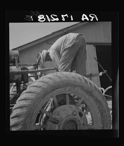 The tractor driver is colored. His wages when he works is one dollar…, Mississippi, 1937