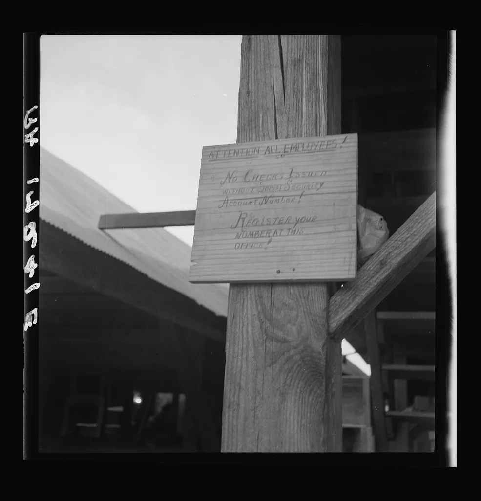 Sign at a tomato packing shed for migrant and local labor.…, Mississippi, 1937