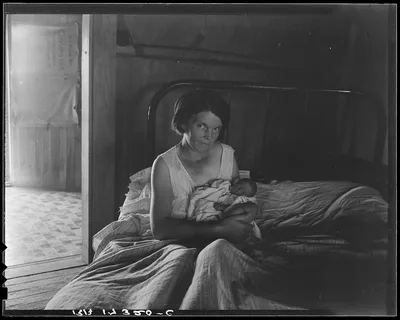 Sharecropper's wife and her youngest child. Near Cleveland,…, Mississippi, 1937