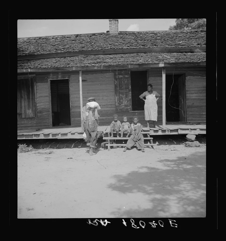 Negro wage laborer and part of his family. He is coming home from the…, Georgia, 1937