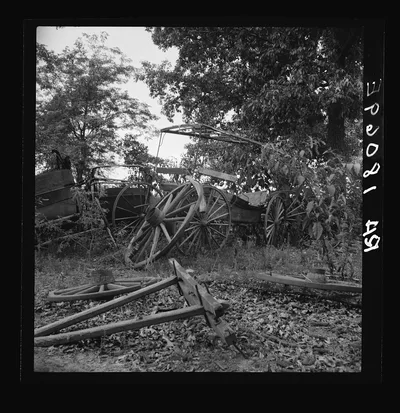 Abandoned coaches and wagons behind the old blacksmith shop on the…, Georgia, 1937