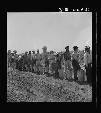 Migrant pea pickers from many states line up with their filled…, California, 1938