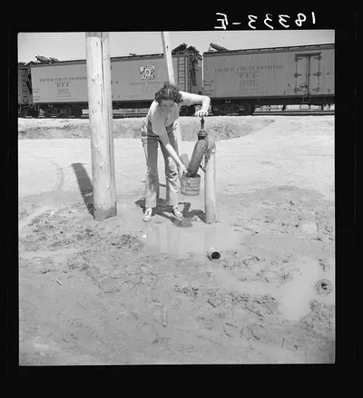 One faucet by the packing sheds is the only source of water for…, California, 1938