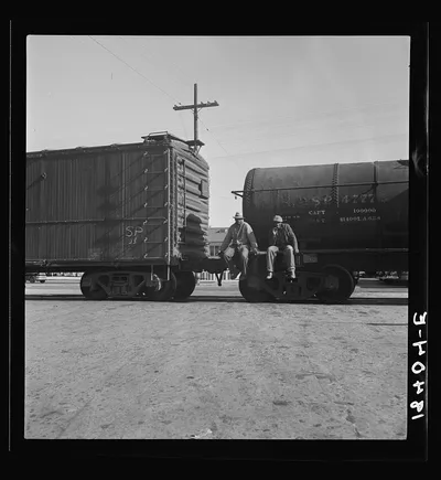 Colored itinerants on oil tank cars passing through Kingsbury,…, California, 1938