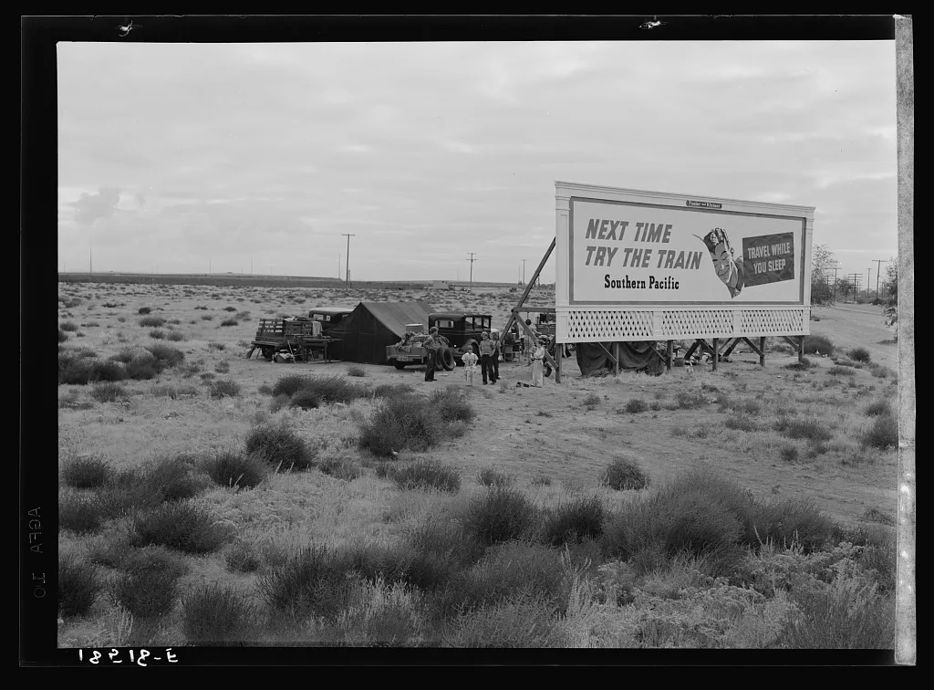 Three families camped on the plains along U.S. 99 in California. They…, 1938