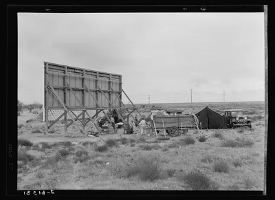 Three families camped on the plains along U.S. 99 in California, 1938