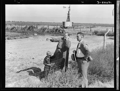 Rural rehabilitation client talking with county supervisor, Farm…, California, 1938