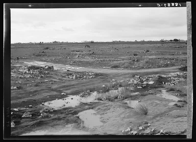 Kern County. Debris left out on the flats where squatters' camp stood…, California, 1939