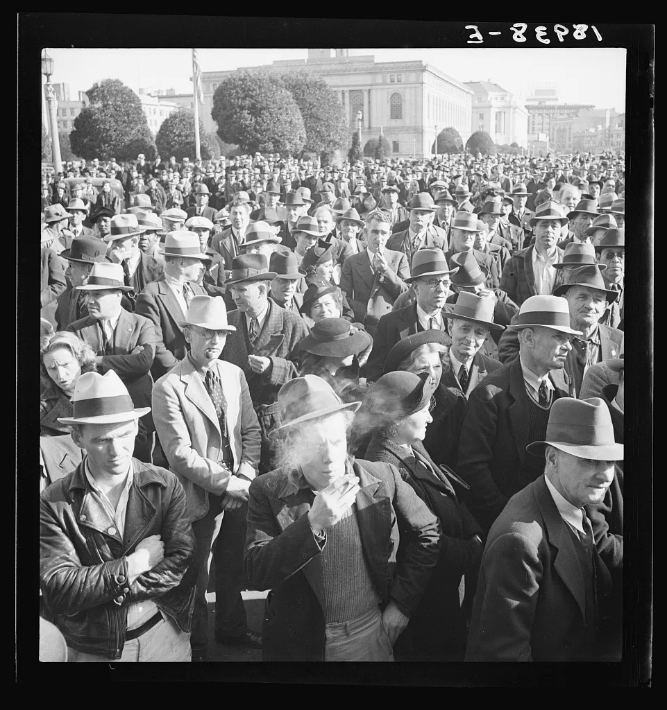 Listening to speeches at mass meeting of Works Progress…, California, 1939