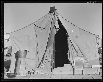 One of a row of tents, home of a pea picker. Near Calipatria,…, California, 1939