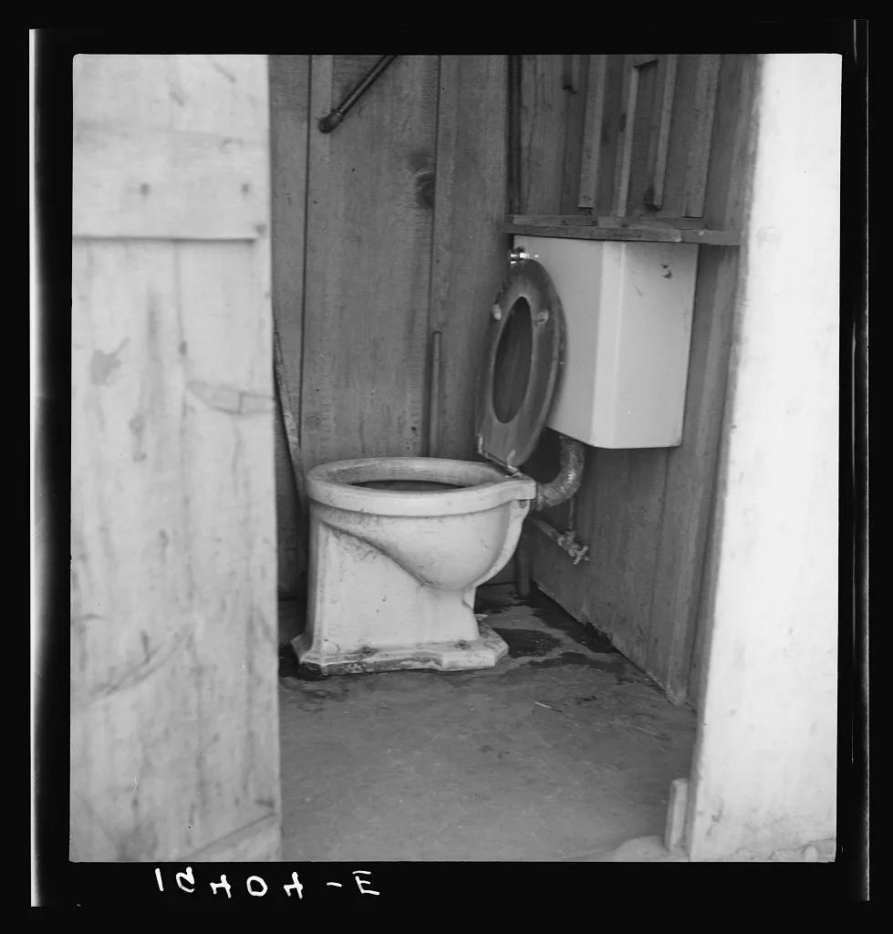 Toilet for ten cabins, men, women and children in auto camp for…, California, 1939