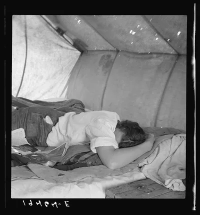 Inside a pea picker's tent in the middle of the morning. No work.…, California, 1939