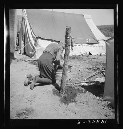 A grandmother washing clothes in California. In a contractor's camp…, 1939