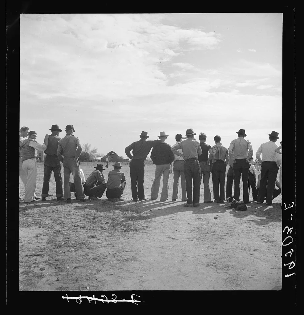 Watching ball game. Shafter camp for migrants. California, 1938
