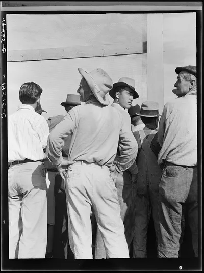 Watching ball game. Shafter migrant camp. California, 1939