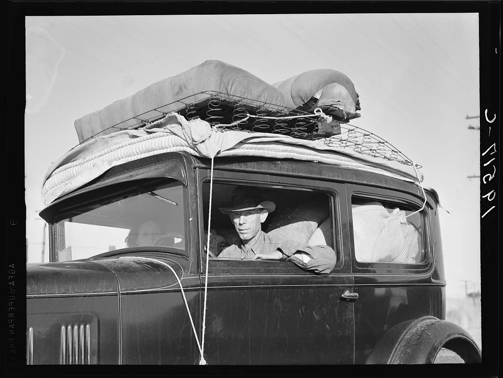 Migratory cotton picker from Kansas on highway near Merced, California, 1939